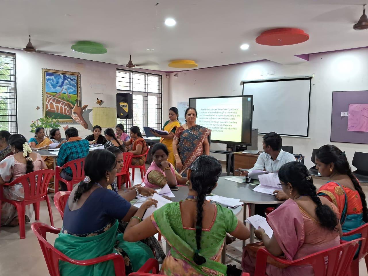 A group of teachers are getting trained under the guidance of a senior staff in the event of teacher training program, held in a cbse affiliated school in Mayiladuthurai.
